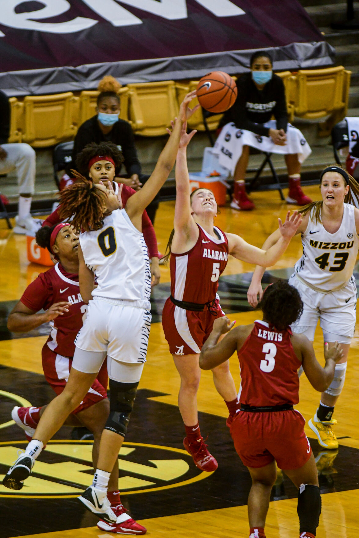 University of Missouri forward LaDazhia Williams and Alabama guard Hannah Barber reach for the ball after a missed basket